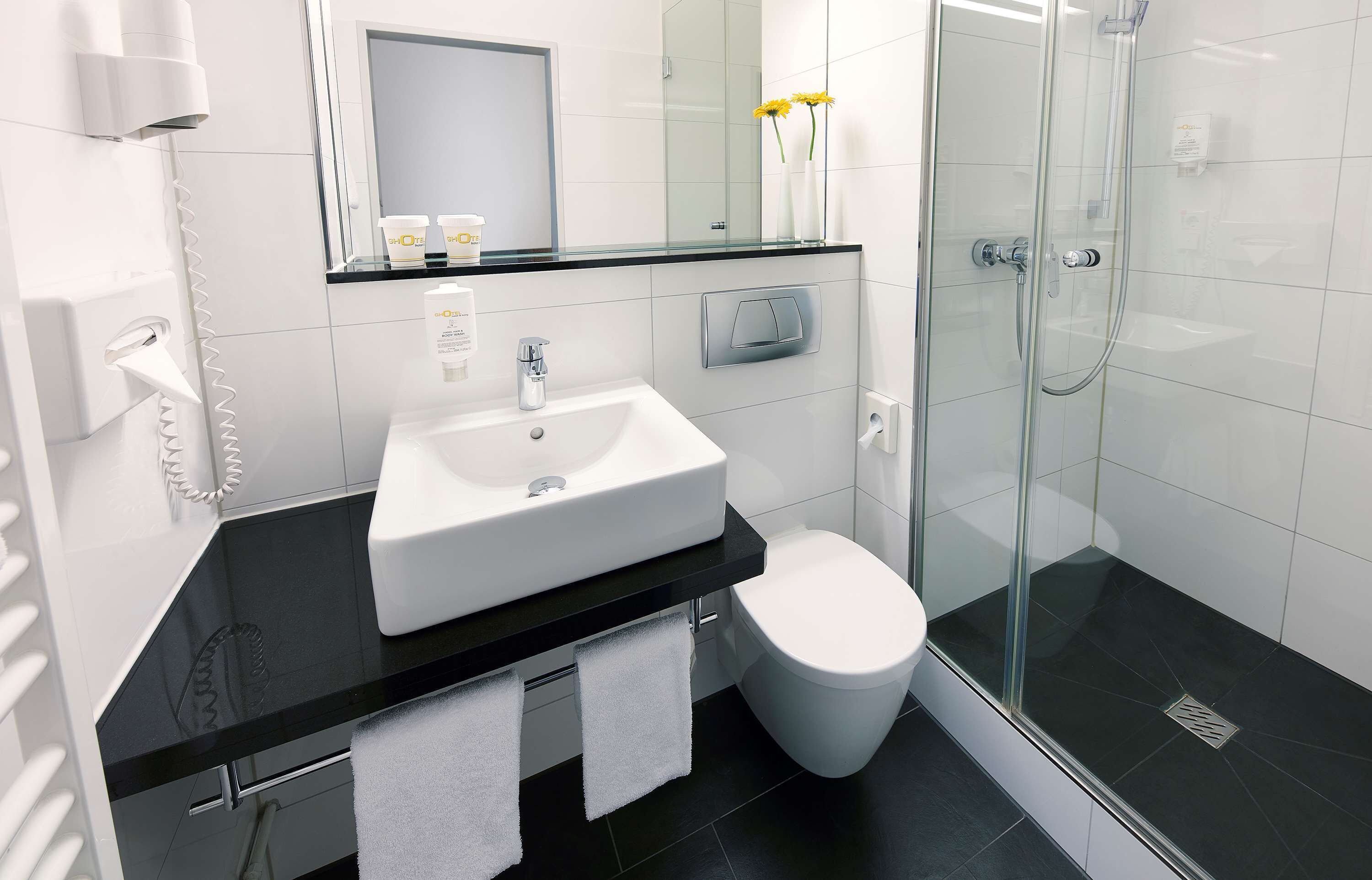 shower, eco-friendly toiletries, hair dryer, towels