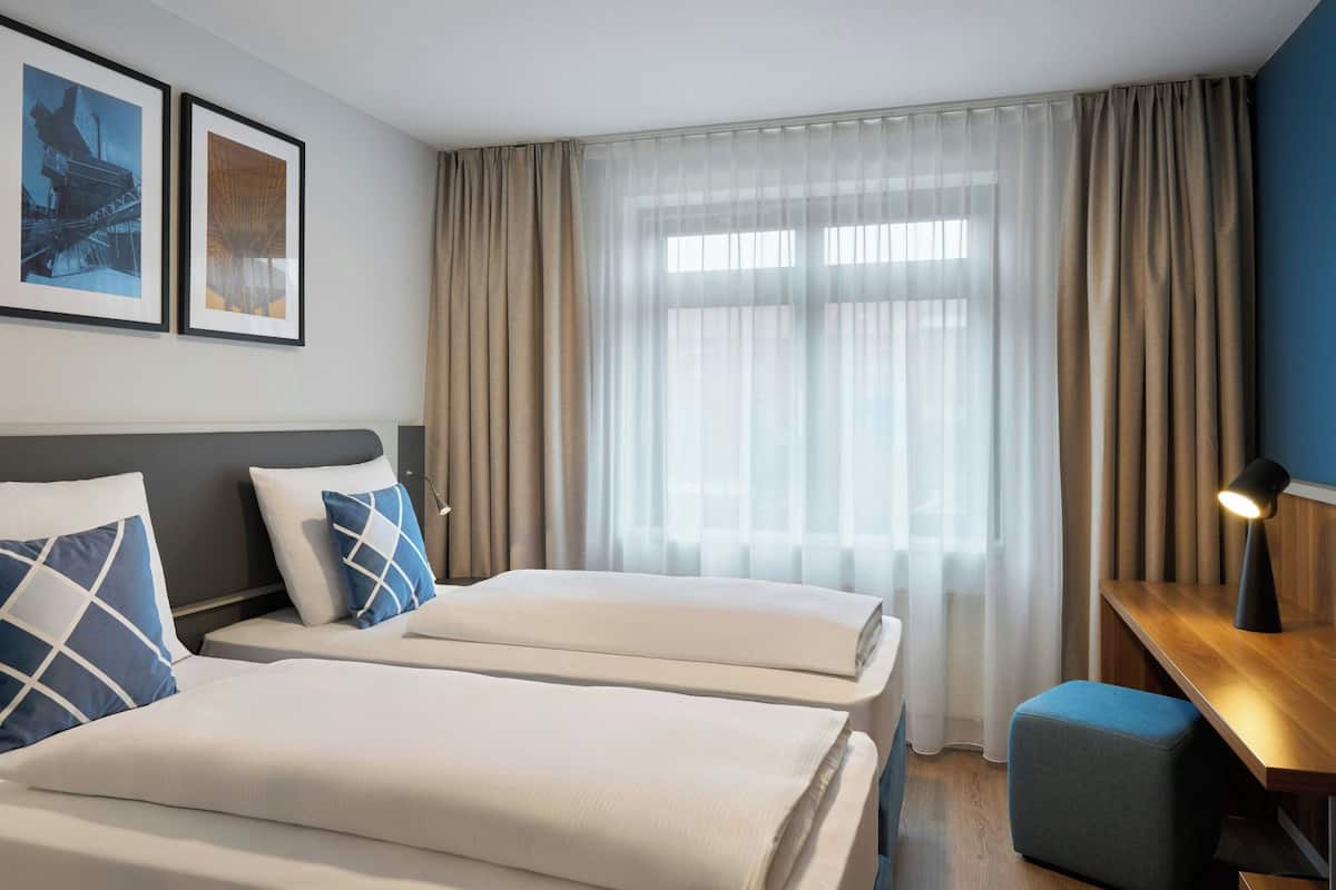 Standard Room, 2 Single Beds, Garden View | In-room safe, desk, soundproofing, free cots/infant beds