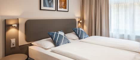 Habitación triple | Caja fuerte, escritorio, sistema de insonorización y cunas gratuitas