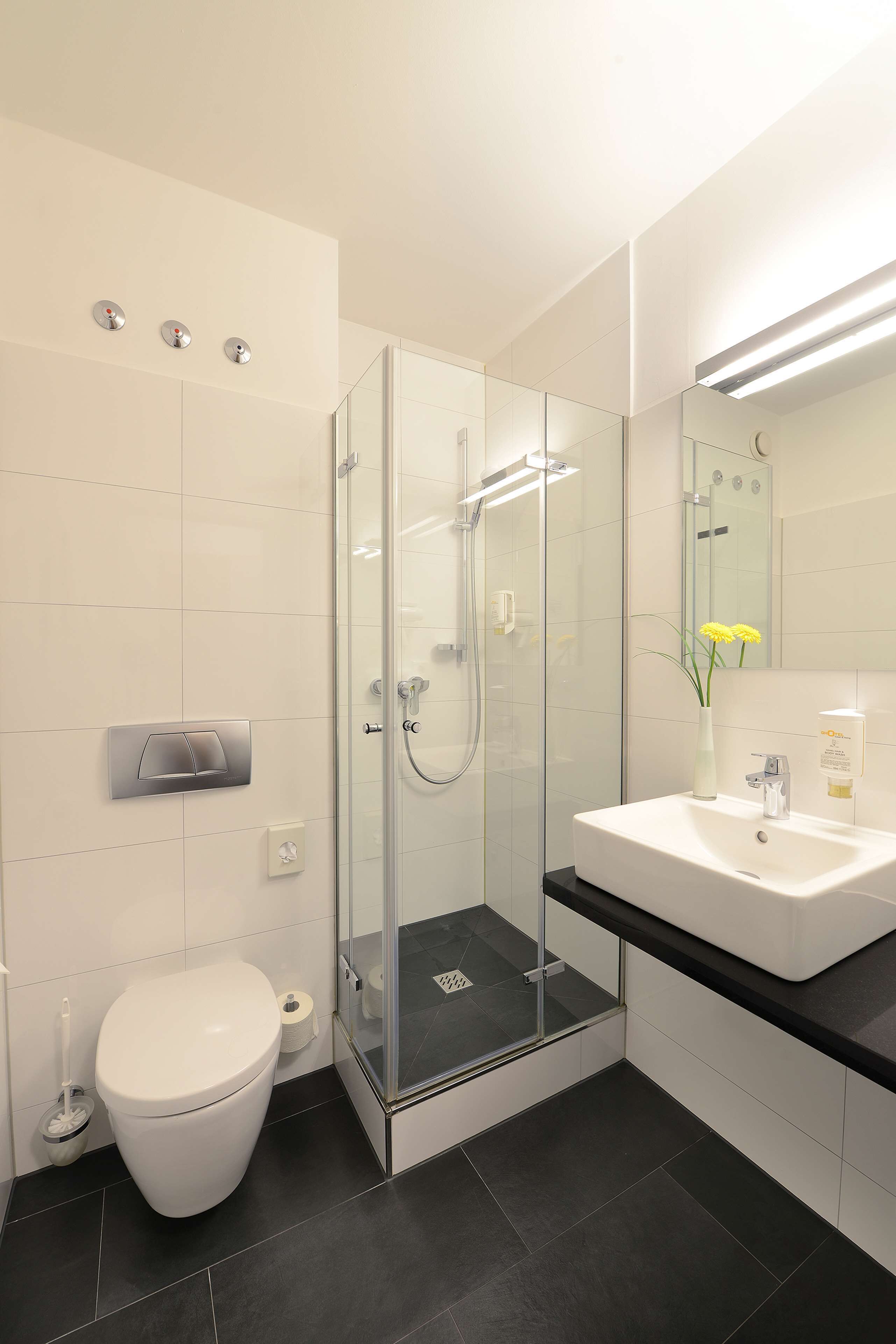 shower, eco-friendly toiletries, hair dryer, towels