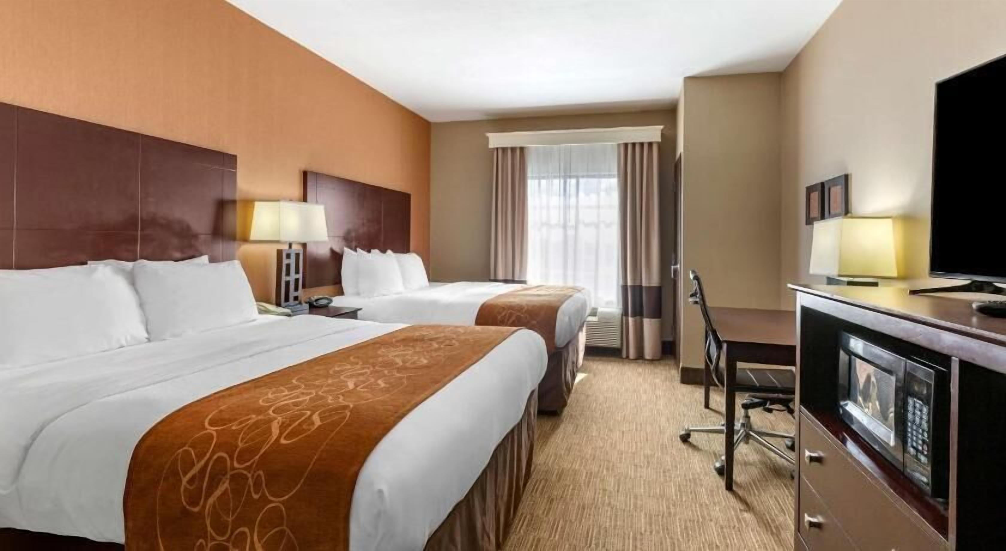Premium bedding, pillow-top beds, desk, blackout curtains