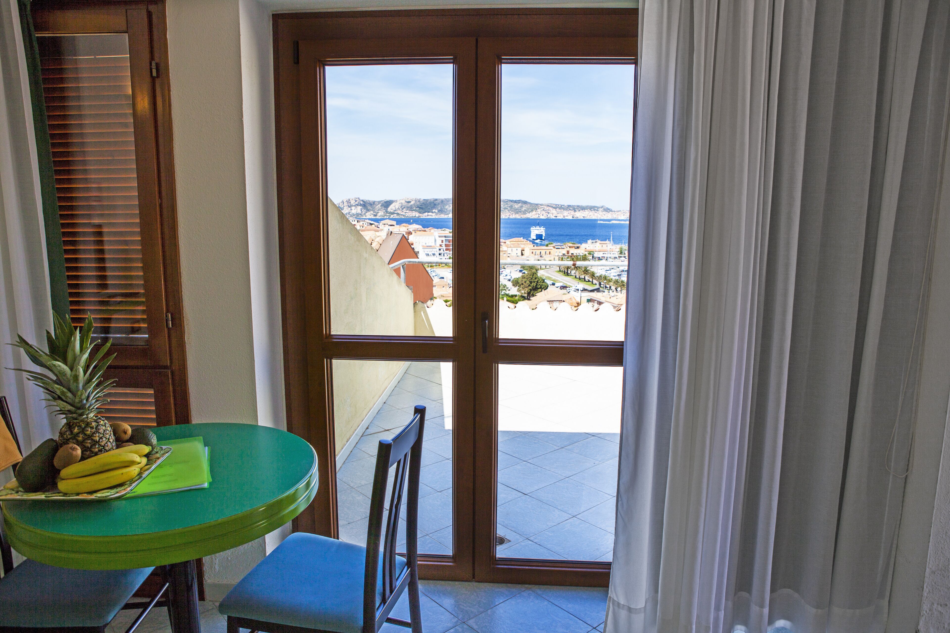 comfort triple room, ocean view | minibar, in-room safe, desk, blackout curtains