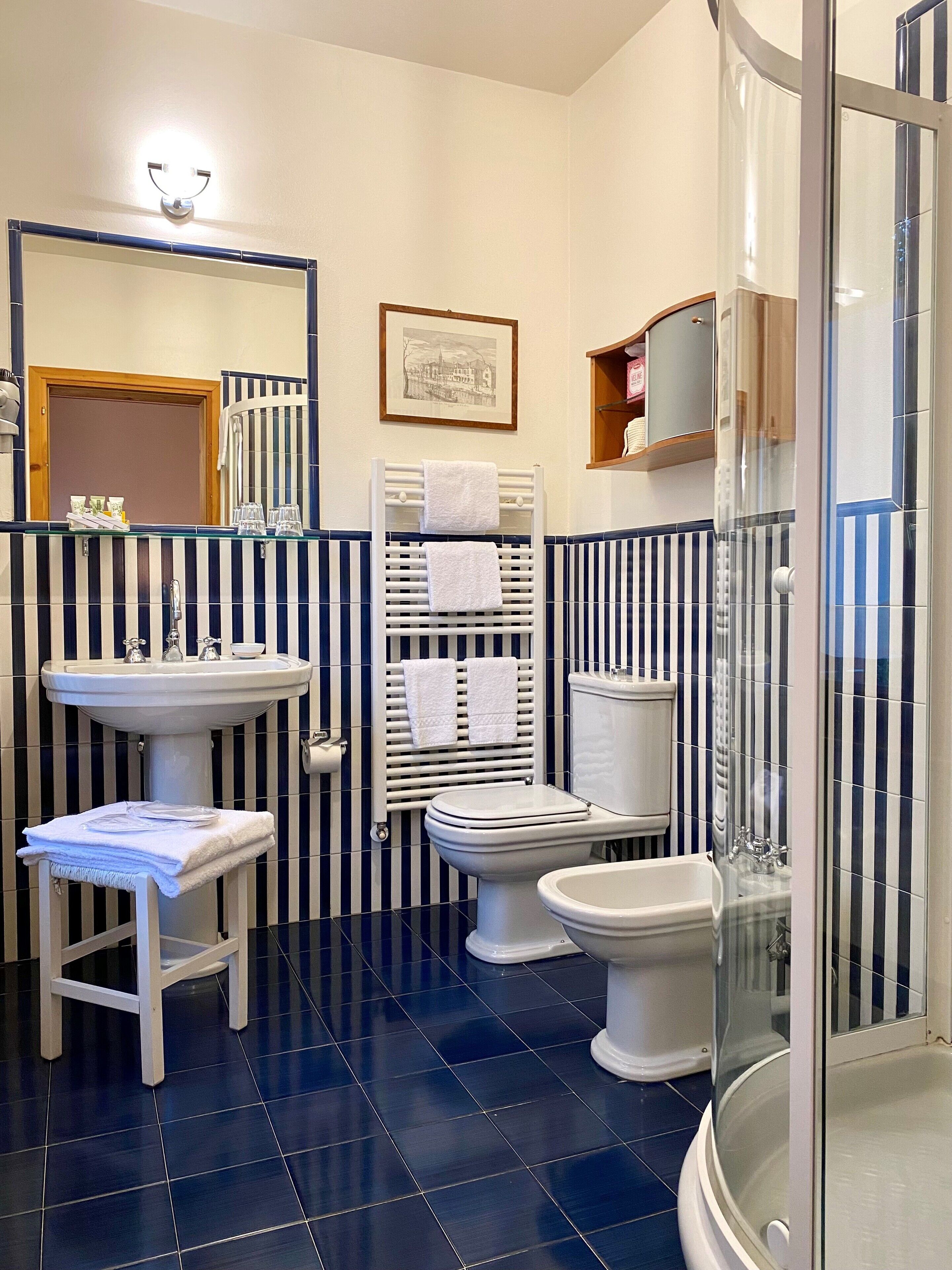 economy room, 1 queen bed | bathroom | free toiletries, hair dryer, slippers, bidet