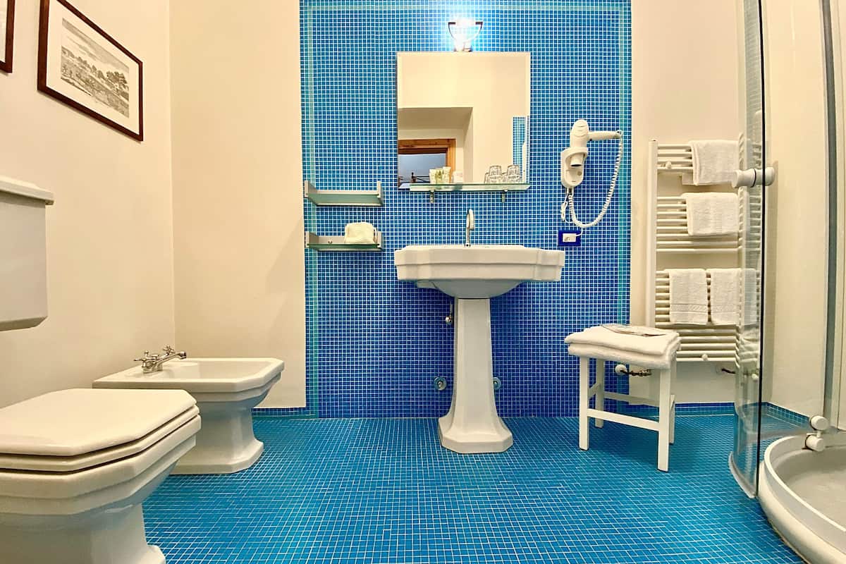 superior room, 1 queen bed, garden view | bathroom | free toiletries, hair dryer, slippers, bidet