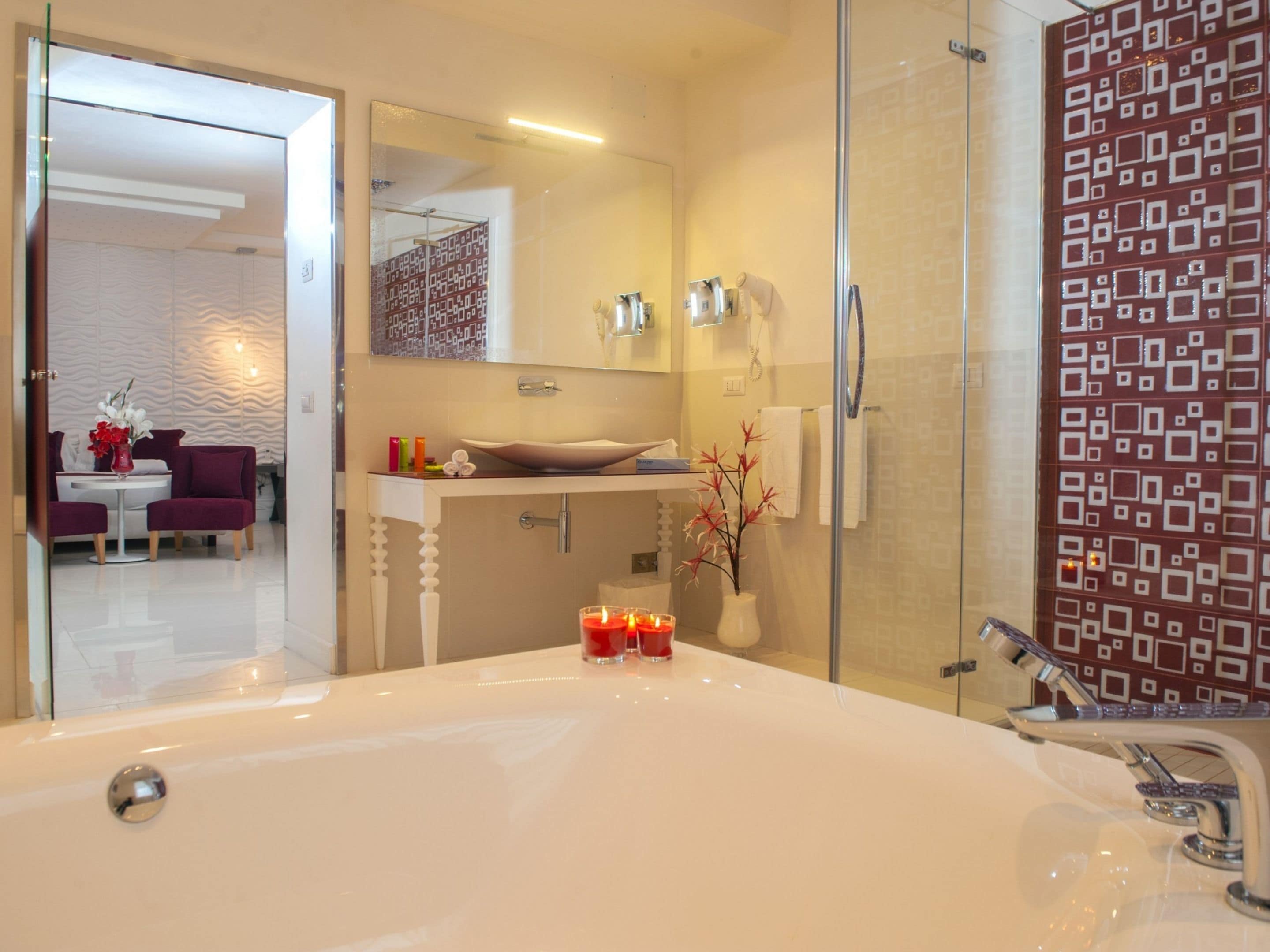 junior suite | bathroom | shower, designer toiletries, hair dryer, bidet