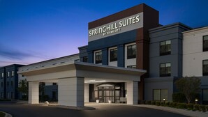 A modern hotel entrance with a sign reading "Springhill Suites by Marriott".