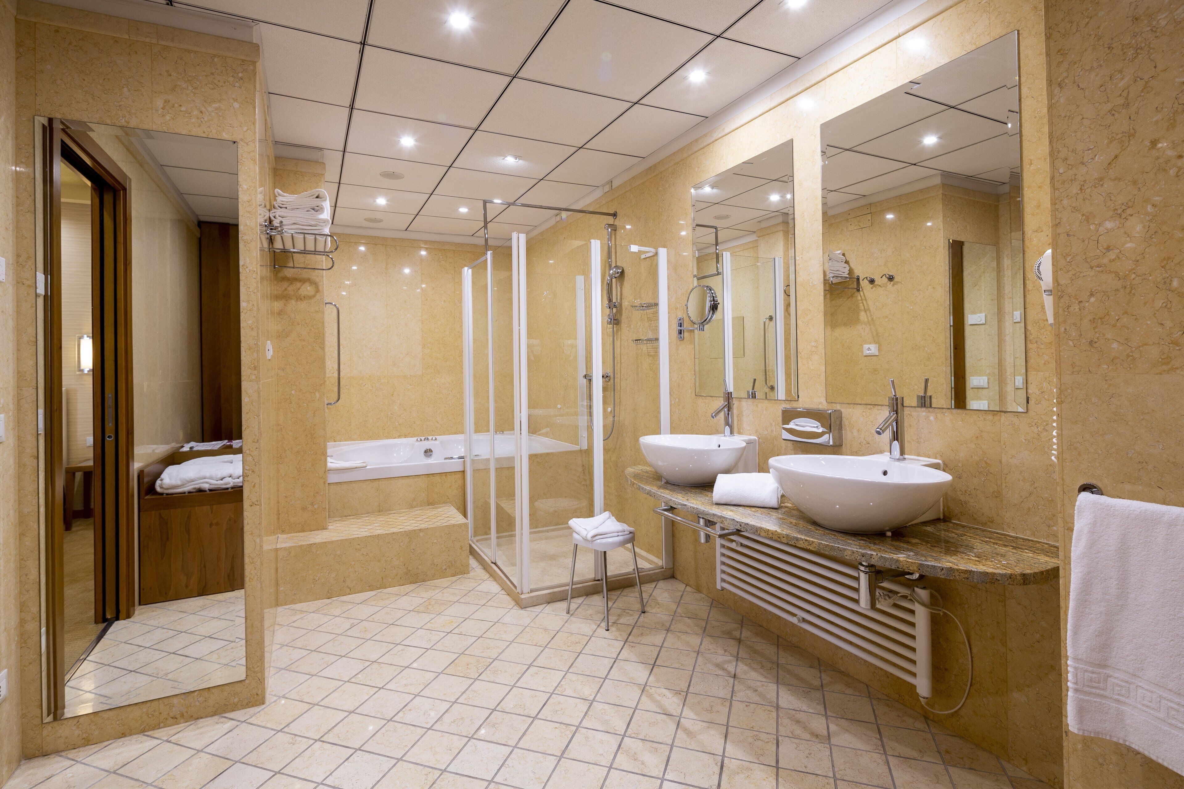suite, 1 king bed (living area) | bathroom | combined shower/bathtub, hair dryer, bathrobes, bidet