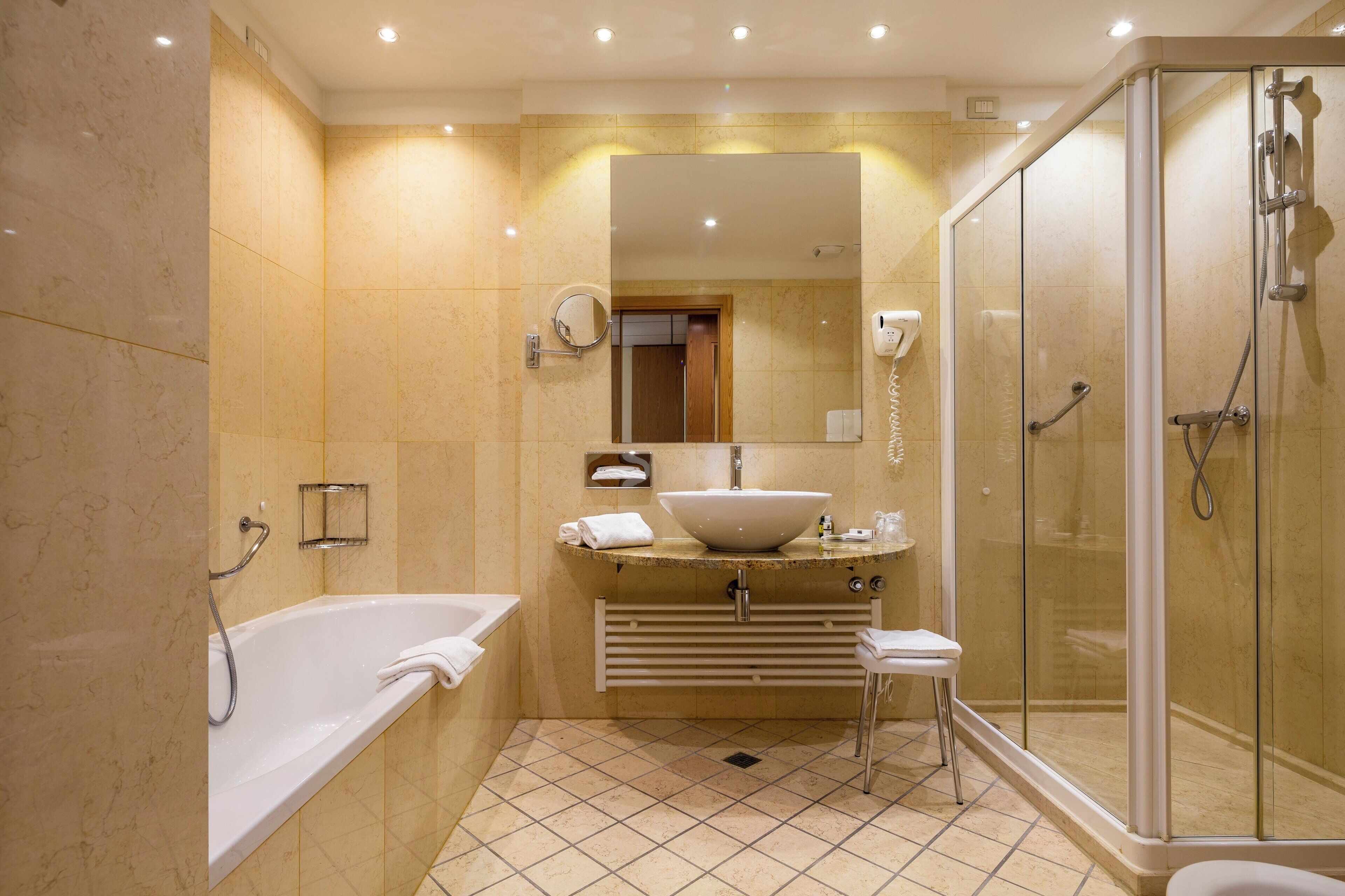 suite, 1 king bed (living area) | bathroom | combined shower/bathtub, hair dryer, bathrobes, bidet