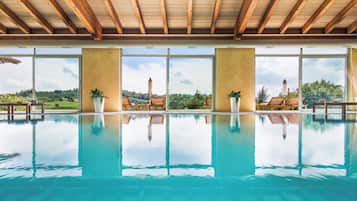 Indoor pool, open 8:30 AM to 8:00 PM, pool loungers