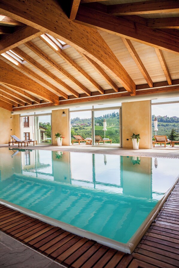 Indoor pool, open 8:30 AM to 8:00 PM, pool loungers