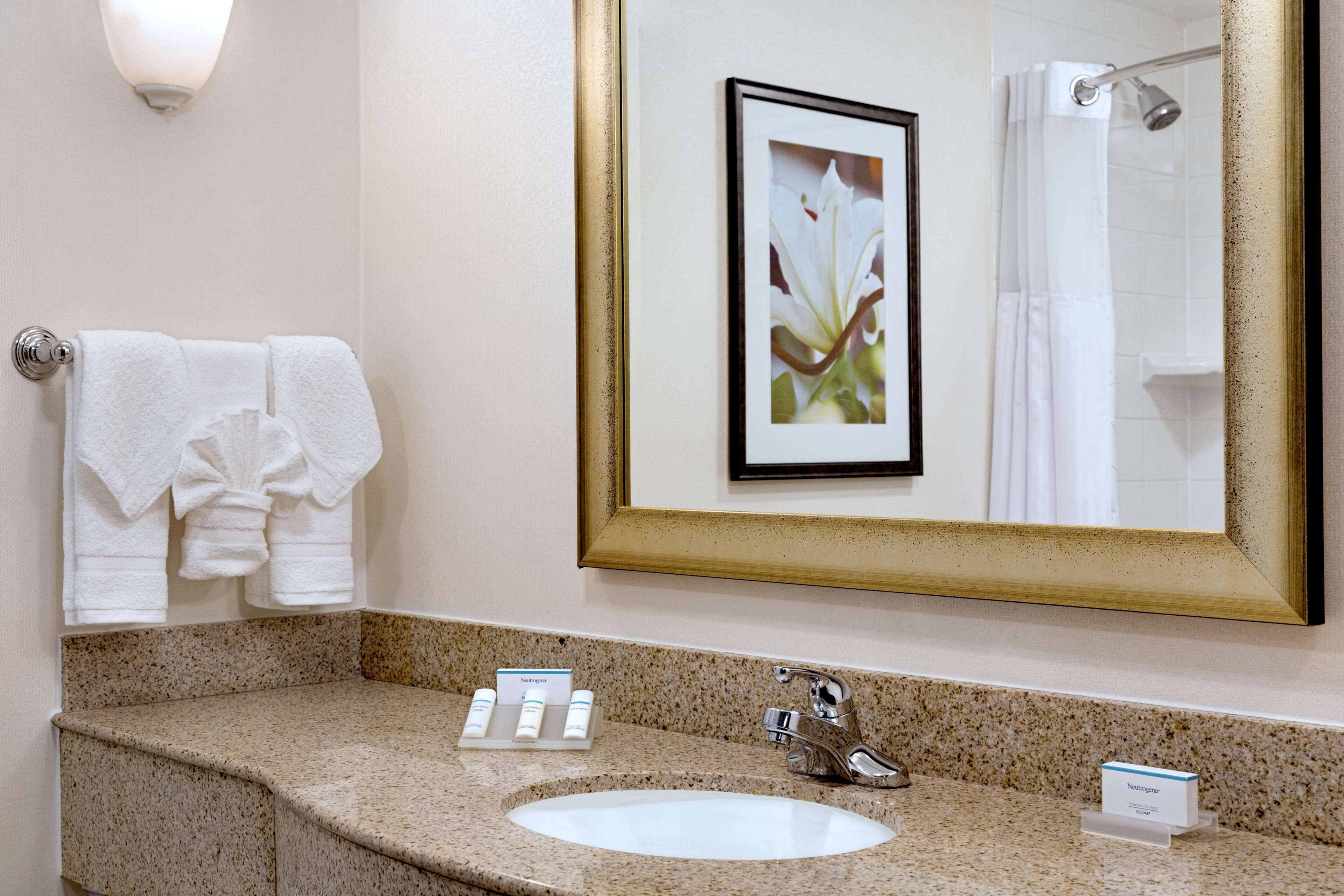 one bedroom suite, one king bed | bathroom | combined shower/bathtub, free toiletries, hair dryer, towels