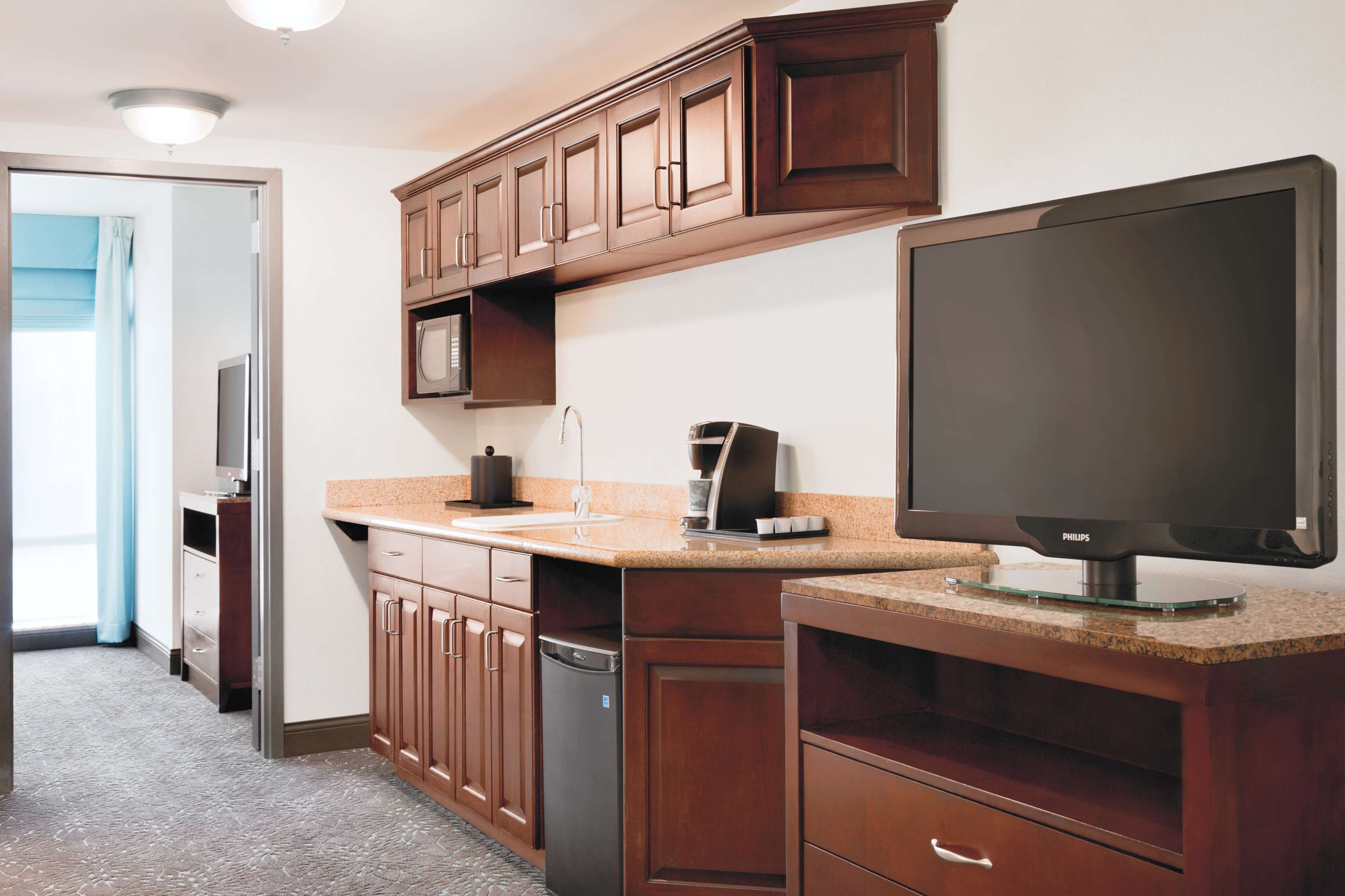 one bedroom suite, one king bed | living area | 37-inch flat-screen tv with cable channels, tv