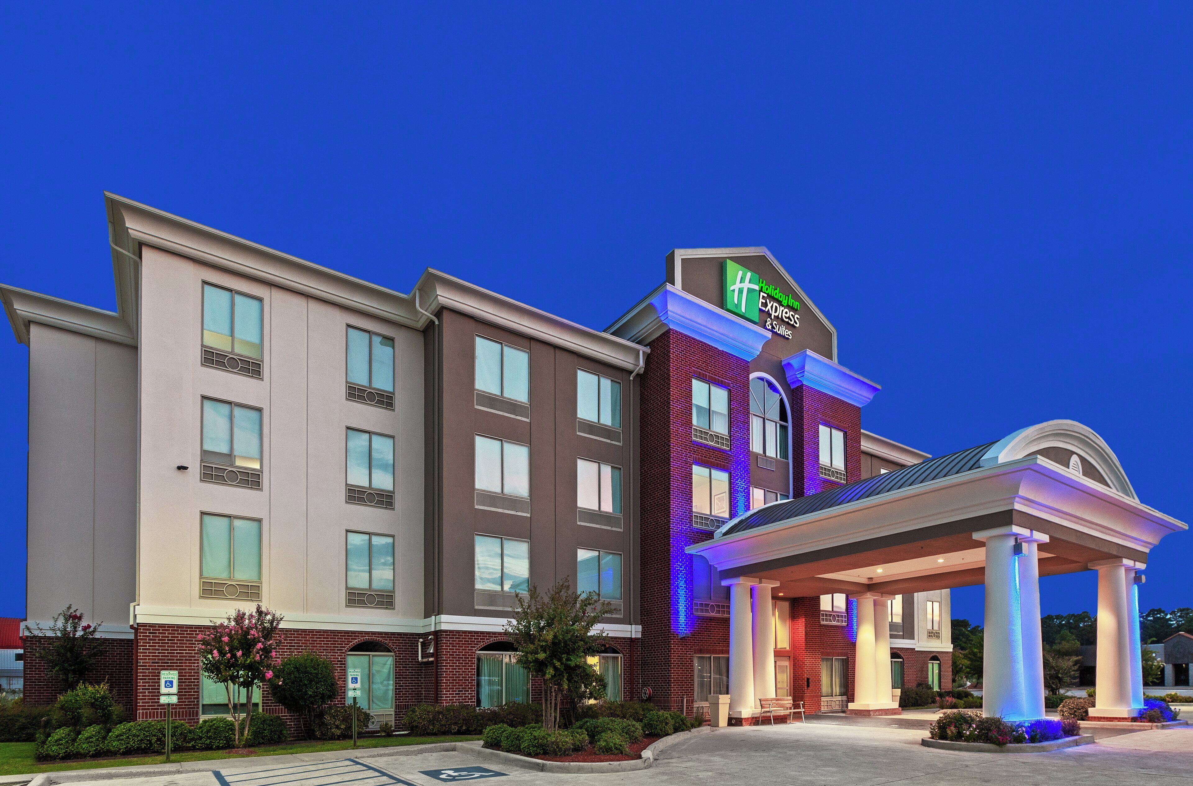 A Holiday Inn Express hotel with a modern facade, multiple stories, and a covered entrance area.