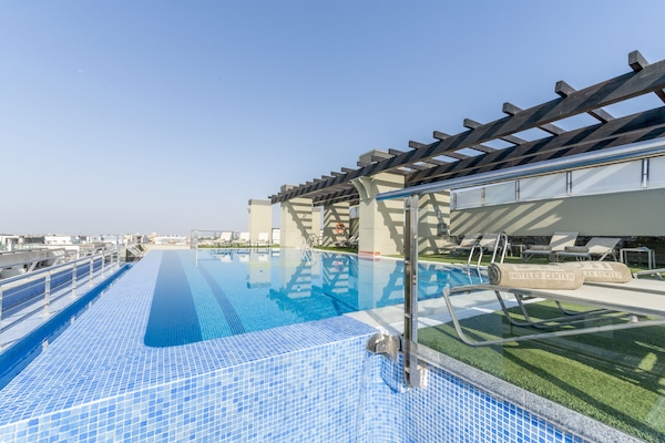 Seasonal outdoor pool, pool umbrellas, sun loungers