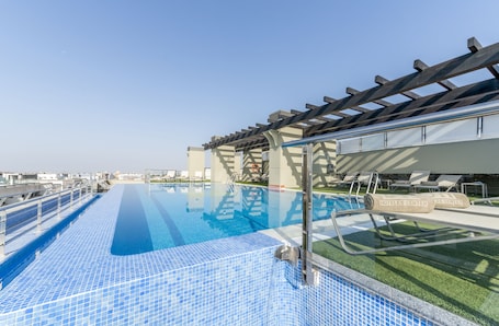 Seasonal outdoor pool, pool umbrellas, sun loungers