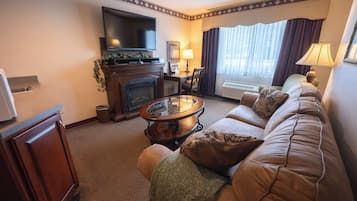 Deluxe Suite | Premium bedding, desk, blackout curtains, iron/ironing board
