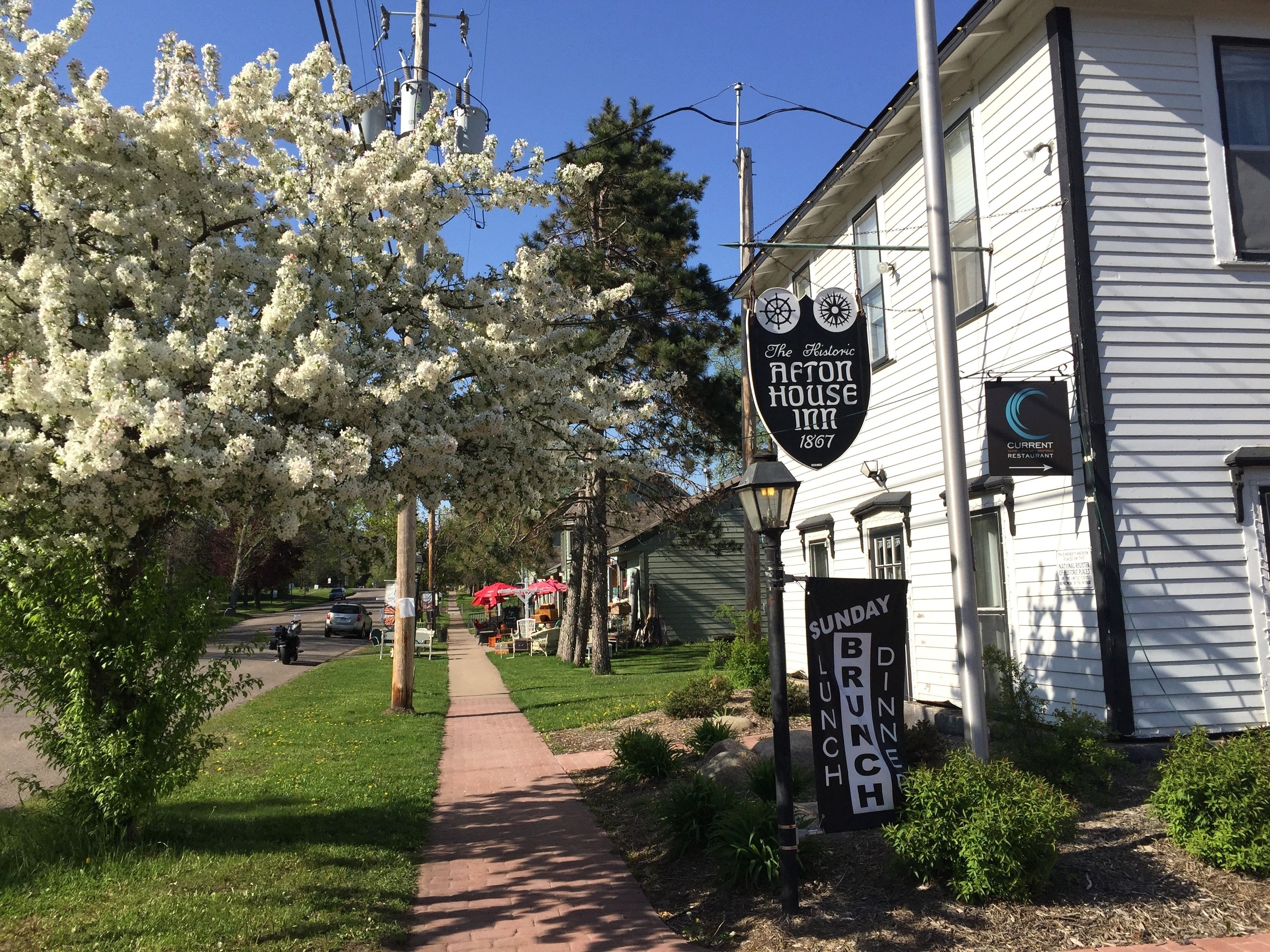The Historic Afton House Inn with a sign indicating Sunday brunch.