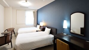 A hotel room with two beds, a desk, a chair, a lamp, and a large mirror. - Chisun Hotel Koriyama (Koriyama)