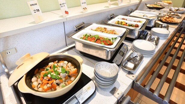 A buffet with various dishes, including a bowl of mixed vegetables and a tray of salad. - Chisun Hotel Koriyama (Koriyama)