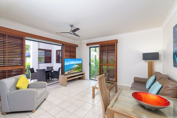 1 Bedroom Pool Entry | Living area | 36-inch flat-screen TV with satellite channels, plasma TV - Meridian Port Douglas - Adults only (Port Douglas)