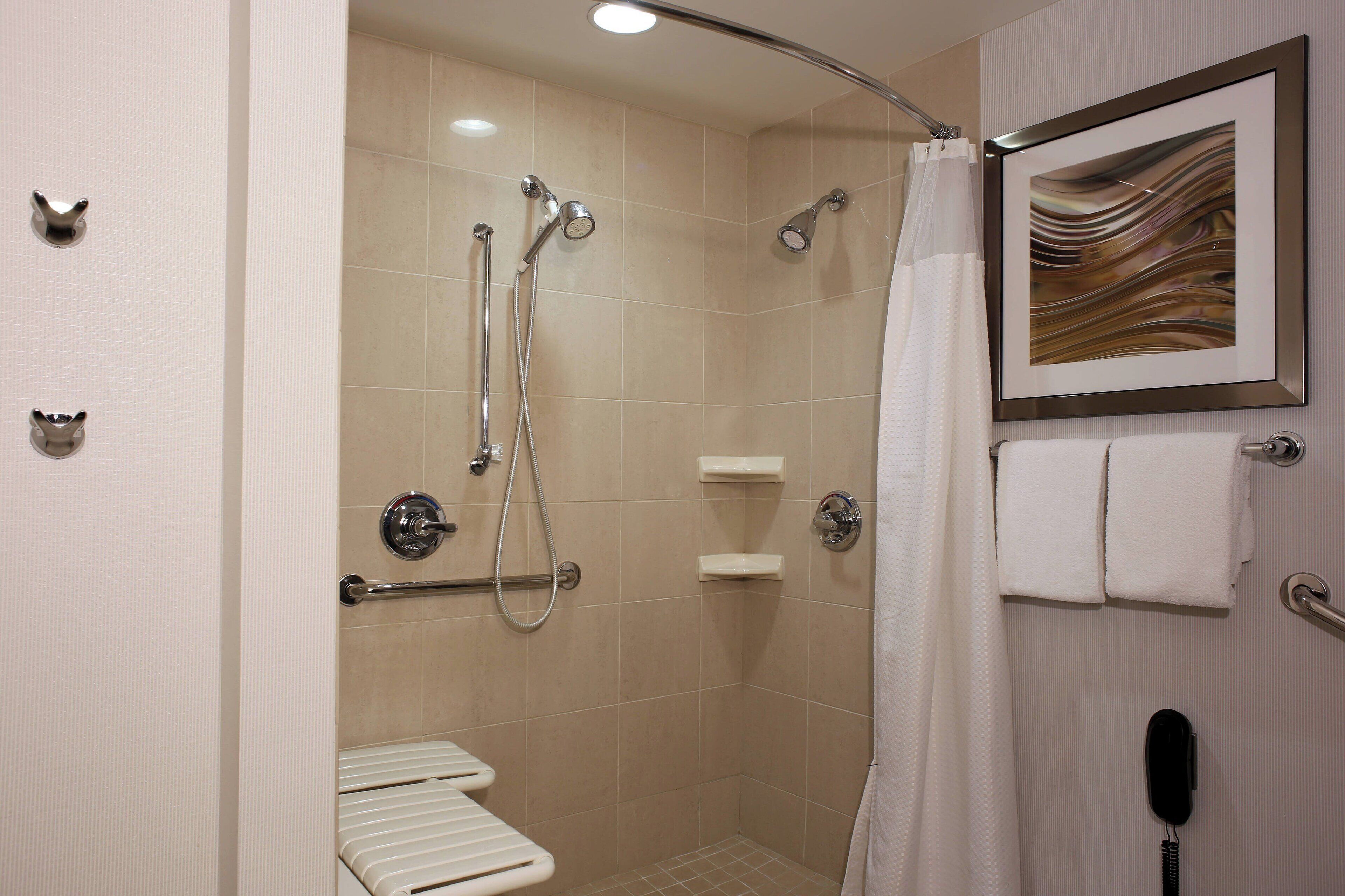 combined shower/bathtub, free toiletries, hair dryer, towels