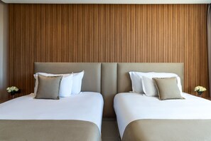 Ropa de cama de alta calidad, colchones con acolchado adicional, minibar