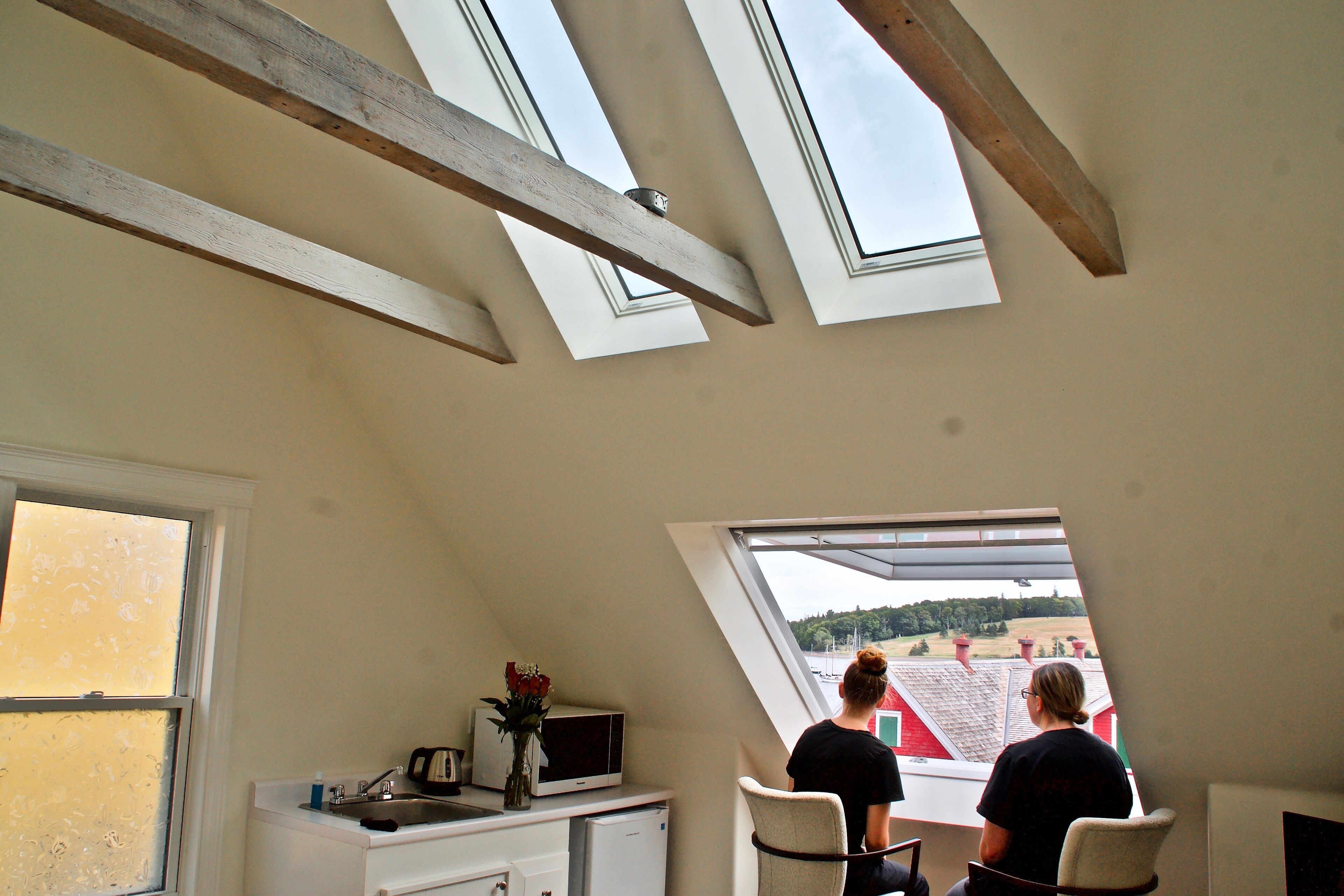 oceanfront studio with panoramic opening skylight | living area | flat-screen tv