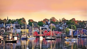 A harbor with boats and colorful buildings. - Rum Runner Inn (Lunenburg)