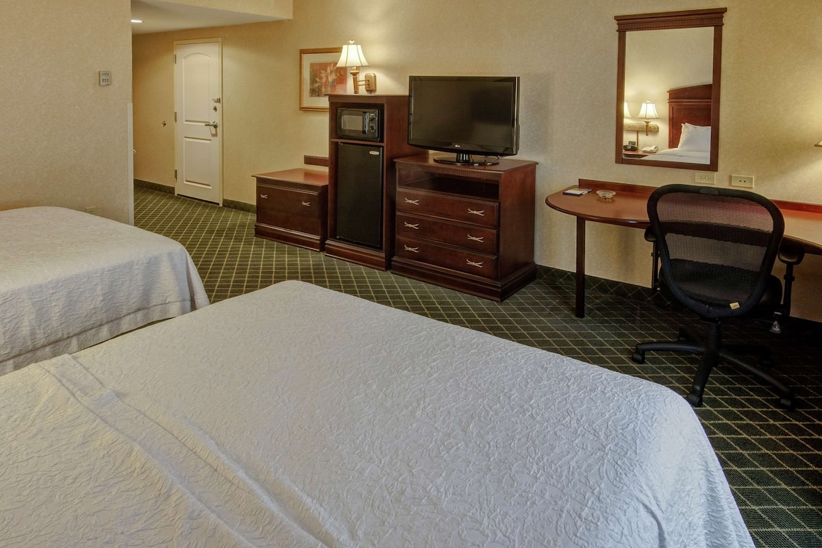Premium bedding, pillow-top beds, desk, laptop workspace
