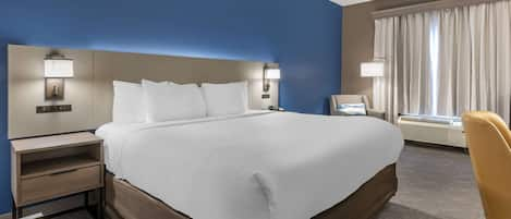 Premium bedding, pillow-top beds, desk, laptop workspace