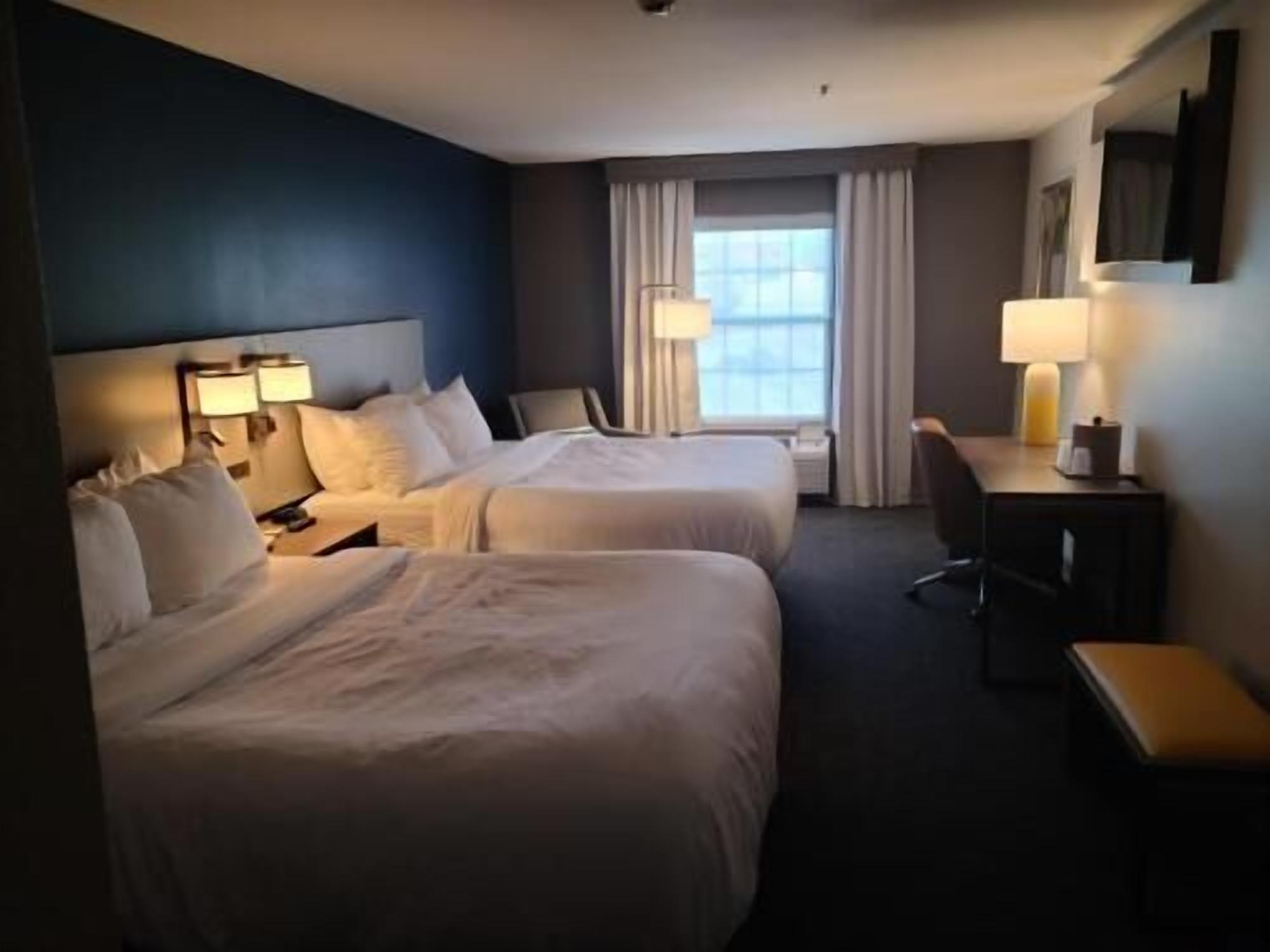 Premium bedding, pillowtop beds, desk, laptop workspace
