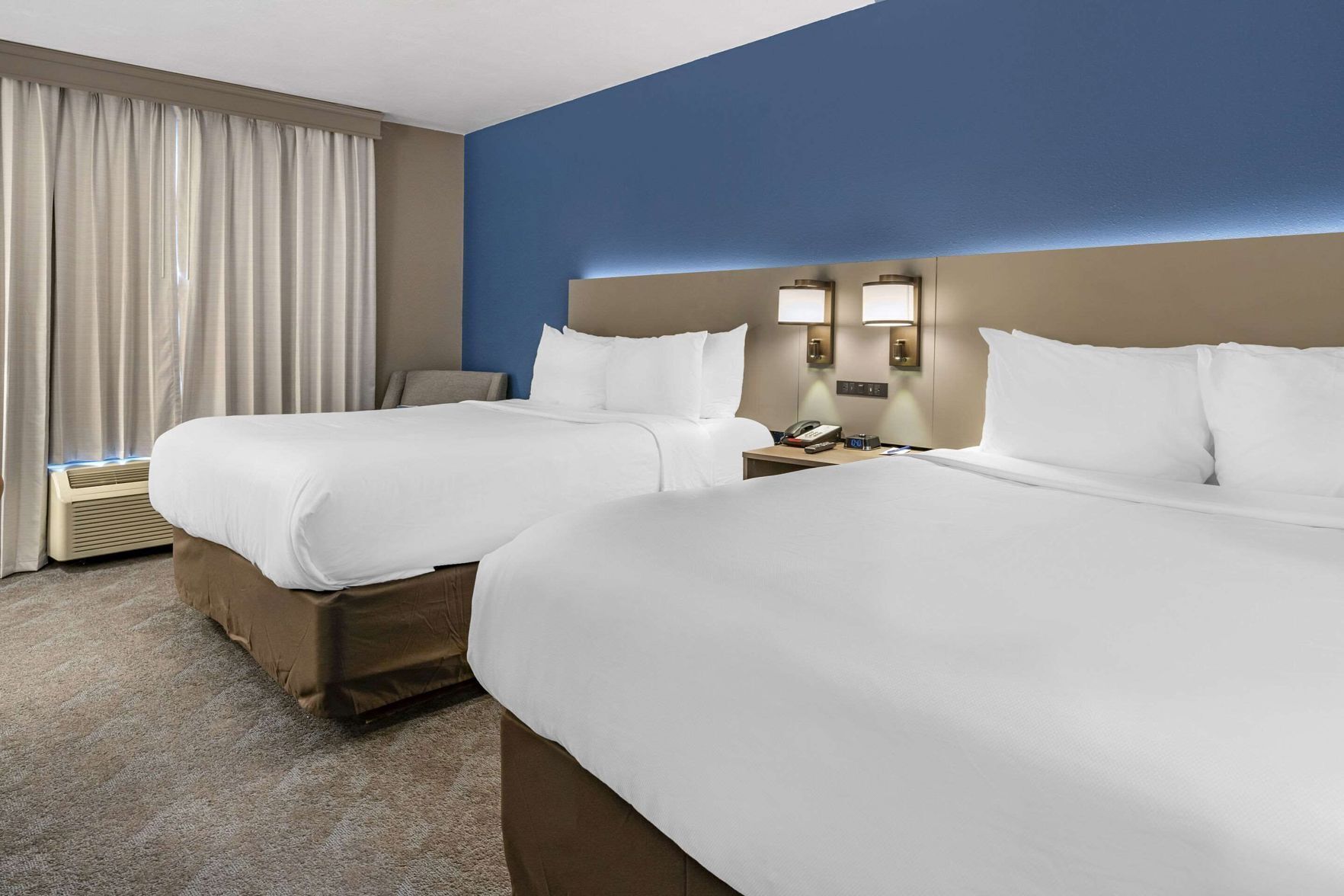 Premium bedding, pillowtop beds, desk, laptop workspace