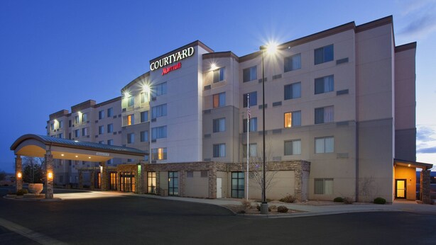 A Courtyard Marriott hotel with a modern facade, multiple floors, and a covered entrance area. - Courtyard by Marriott Grand Junction (Grand Junction)