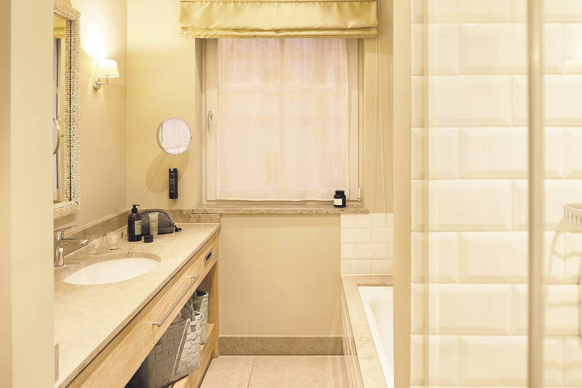 premium suite | bathroom | free toiletries, hair dryer, bathrobes, slippers
