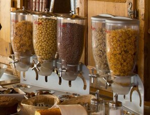 A food dispensing station with various grains and legumes.