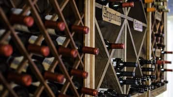 A wine rack with bottles labeled with names like Argentina and Castaña.