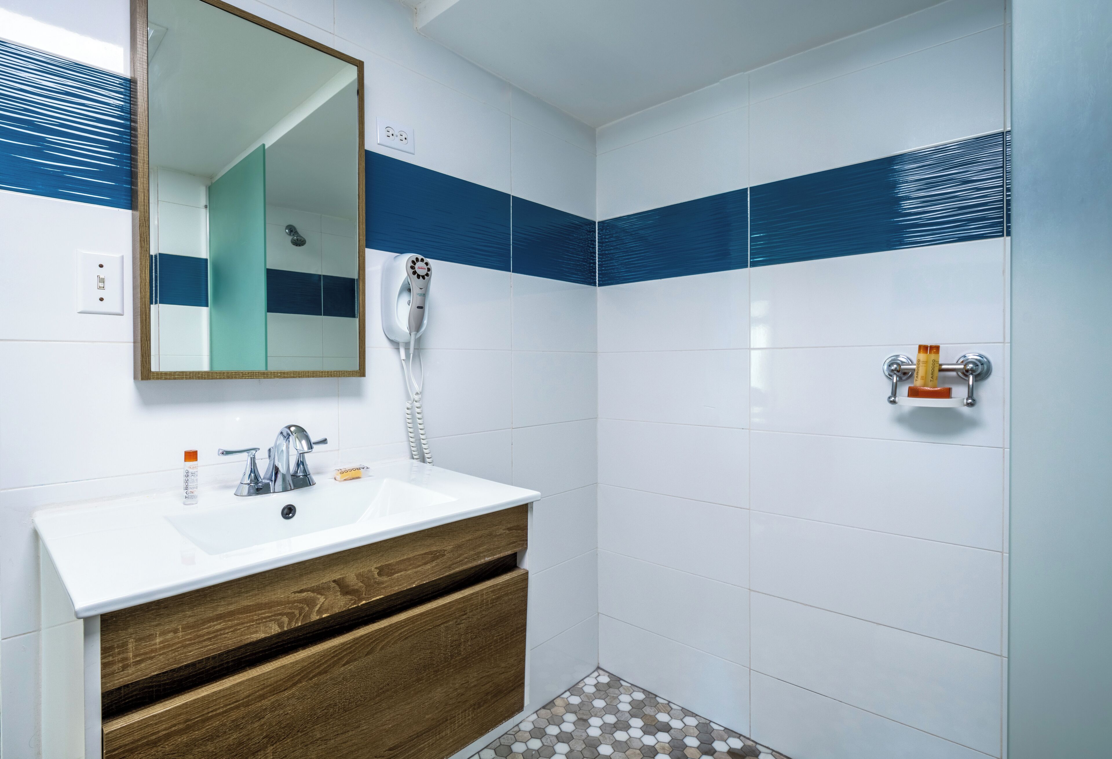 deluxe room, 1 king bed | bathroom | shower, free toiletries, hair dryer, towels