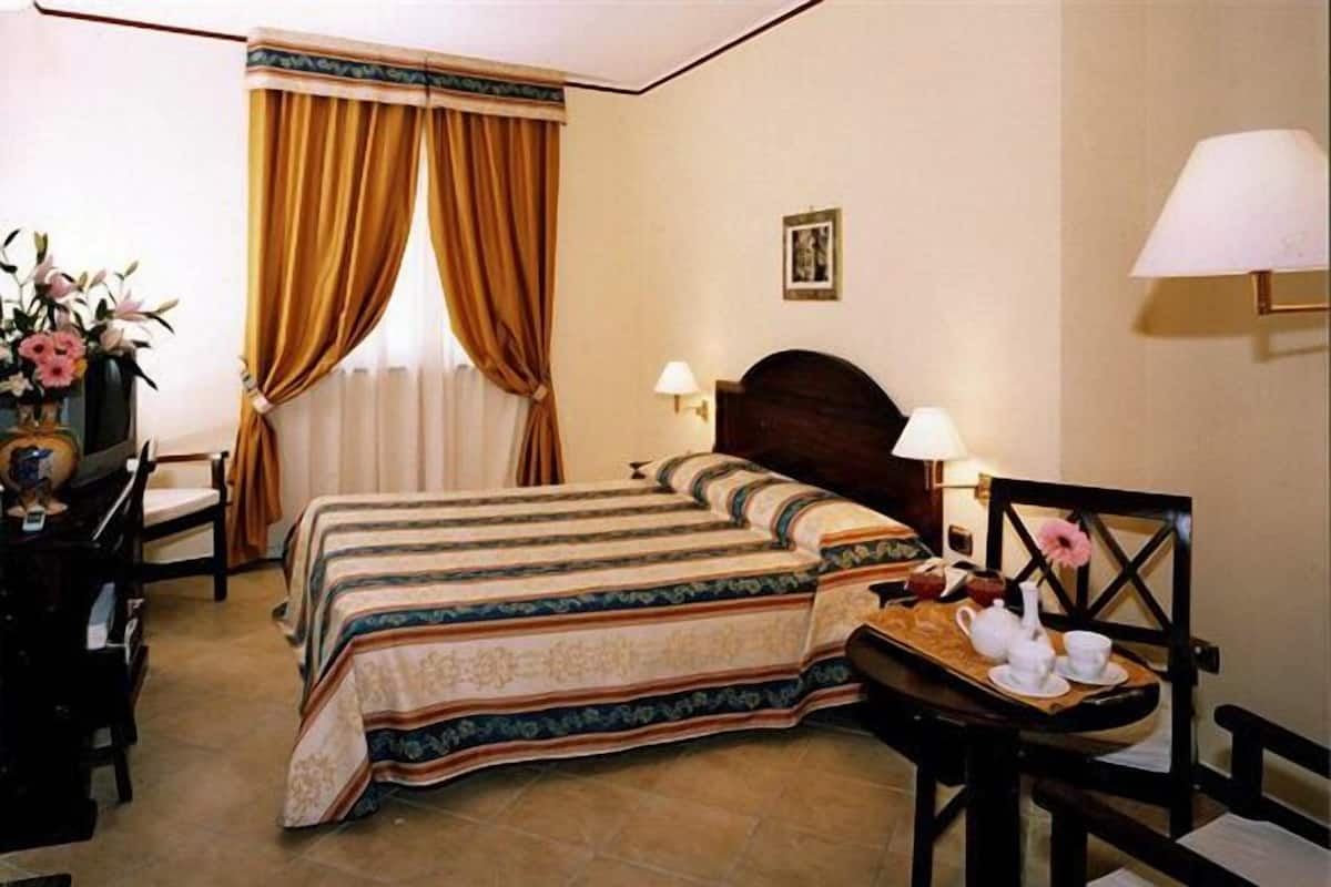 In-room safe, desk, blackout curtains, iron/ironing board (on request)