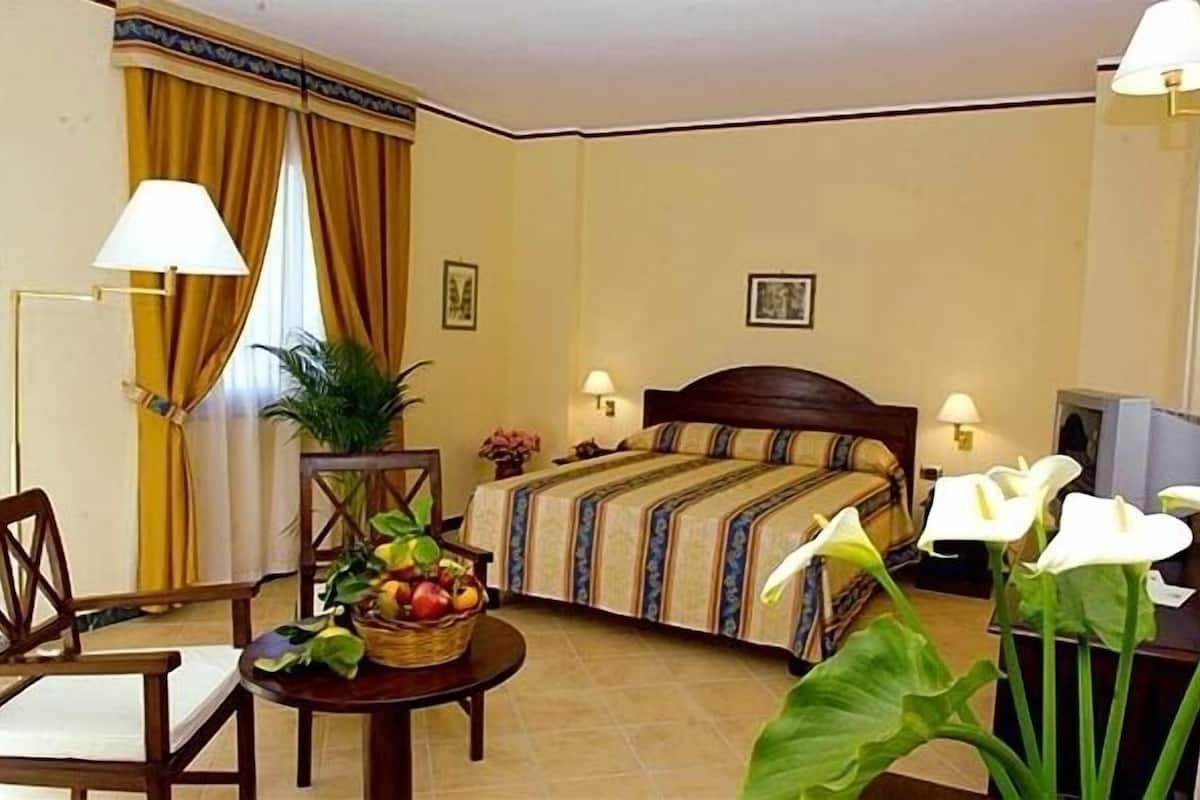 In-room safe, desk, blackout curtains, iron/ironing board (on request)