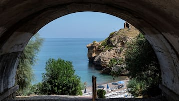 Private beach, sun loungers, beach umbrellas, windsurfing