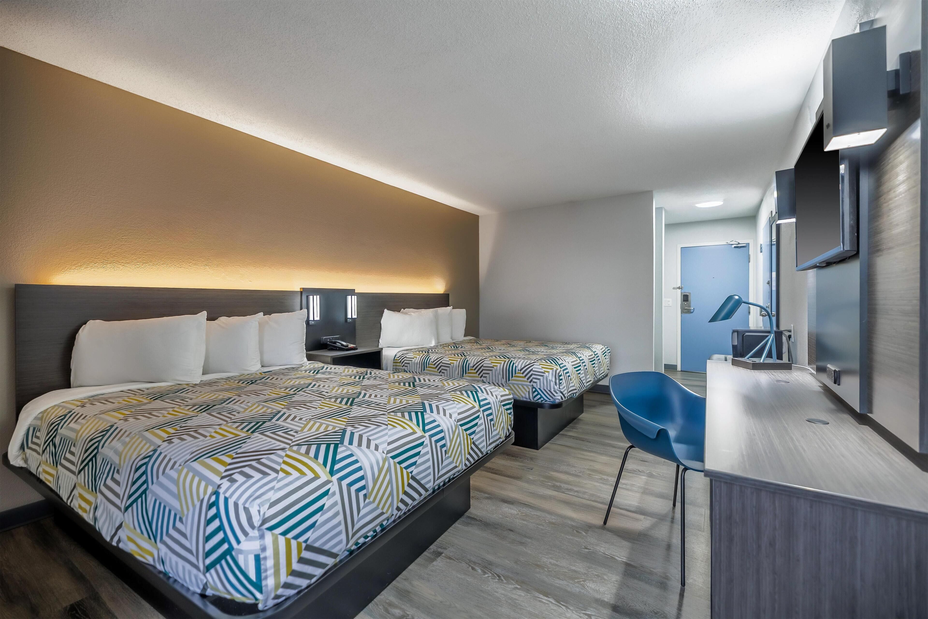 Deluxe Room, 2 Queen Beds, Non Smoking, Refrigerator & Microwave | Free WiFi, bed sheets