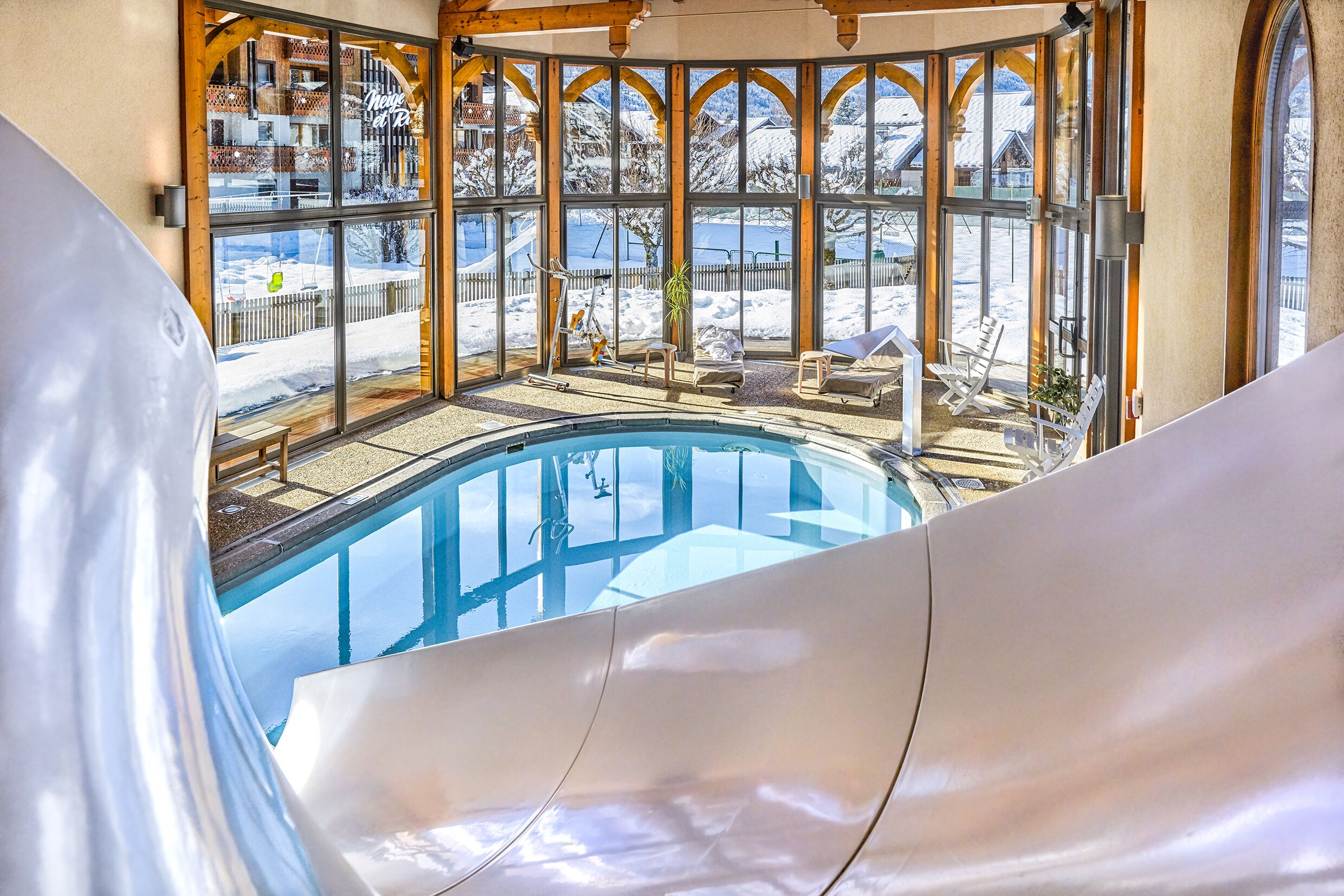 indoor pool, seasonal outdoor pool, pool umbrellas, pool loungers