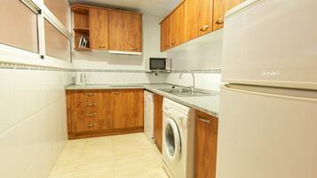 Apartment, 1 Bedroom, Terrace | Private kitchen | Full-sized fridge, microwave, stovetop, dishwasher