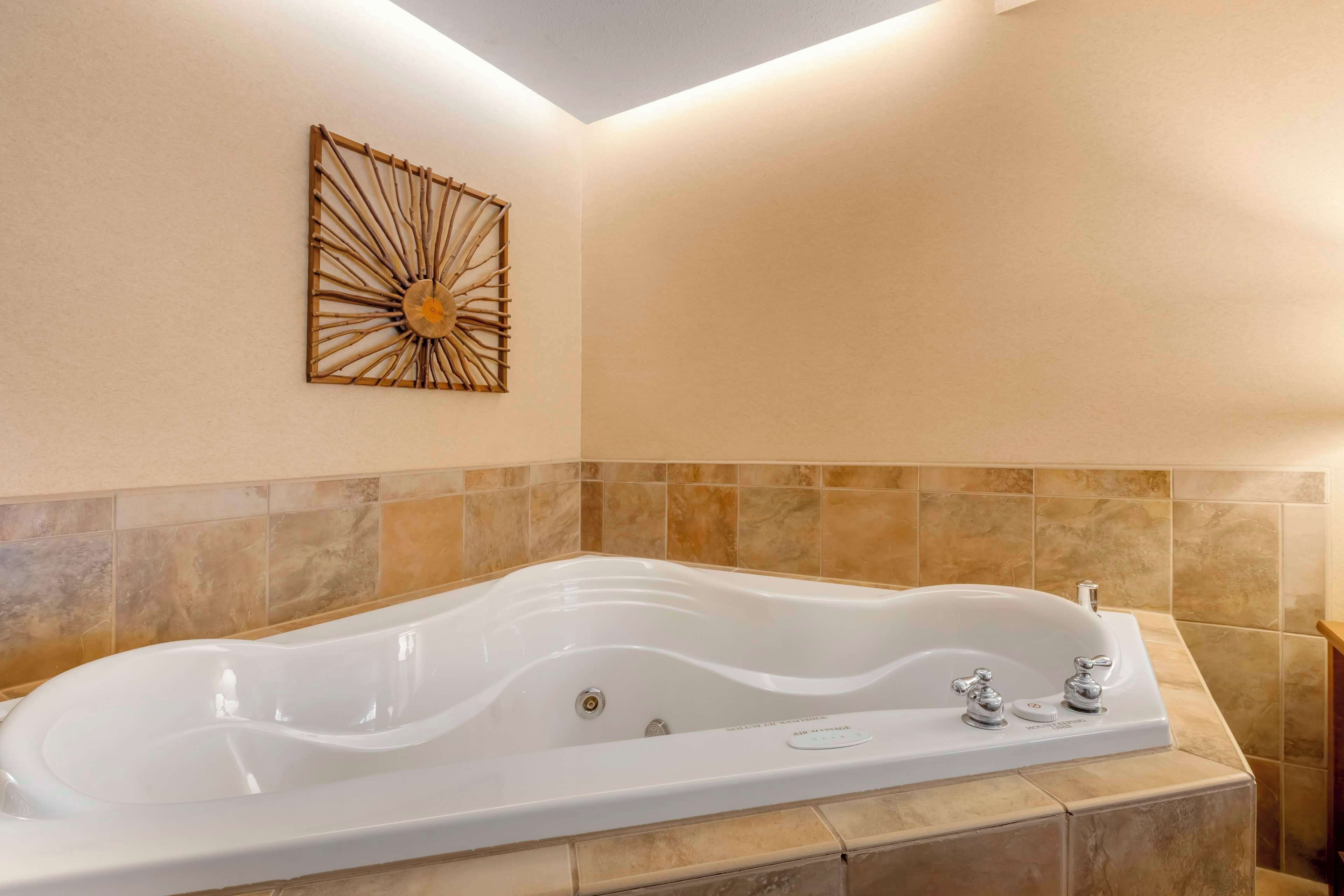 suite, 1 king bed, jetted tub, lakeside | premium bedding, down duvets, desk, iron/ironing board