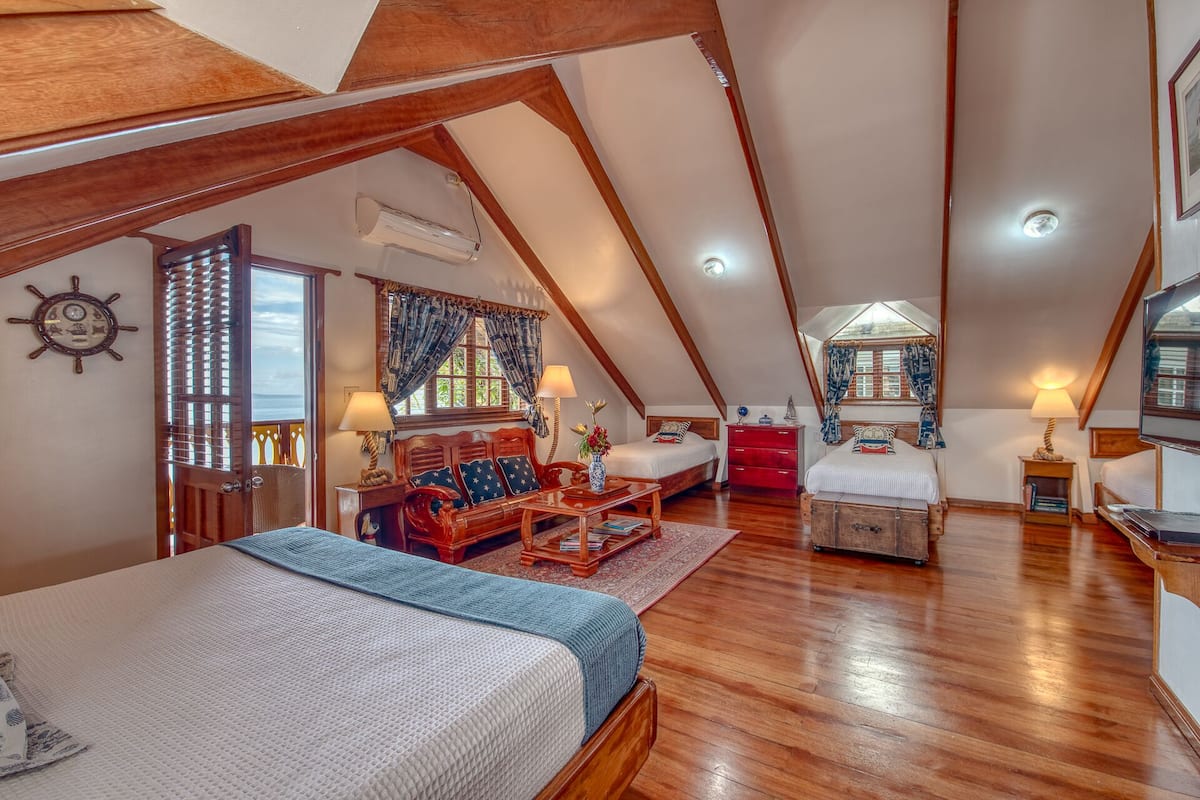 luxury room, sea view | premium bedding, in-room safe, desk, iron/ironing board