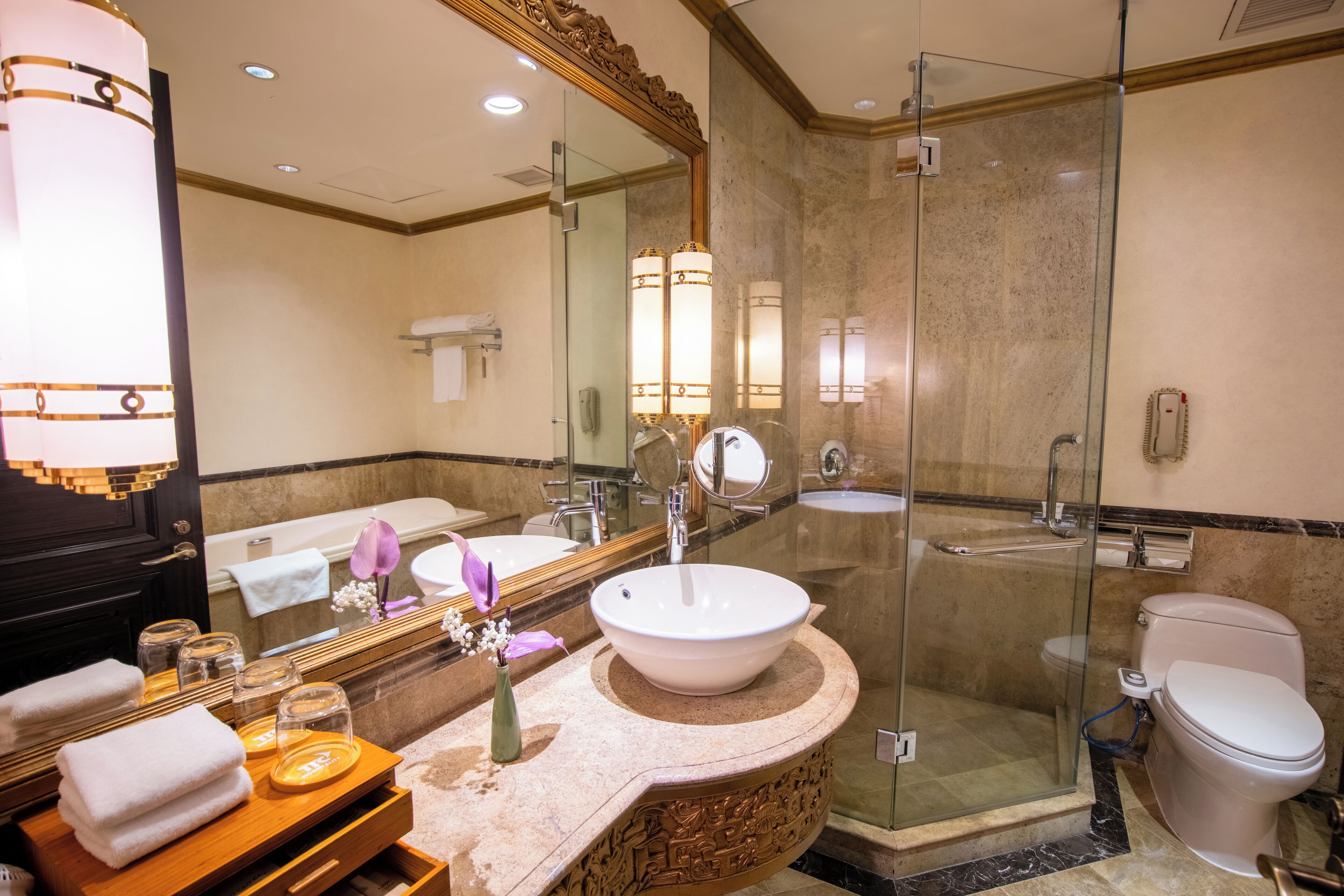 junior suite, 1 king bed, city view | bathroom | separate bathtub and shower, deep-soaking bathtub, designer toiletries