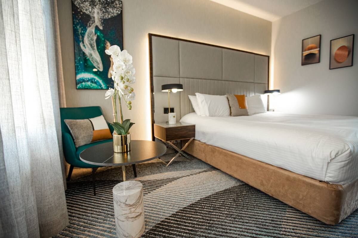 executive room | desk, laptop workspace, blackout curtains, iron/ironing board