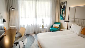 Desk, laptop workspace, blackout drapes, iron/ironing board