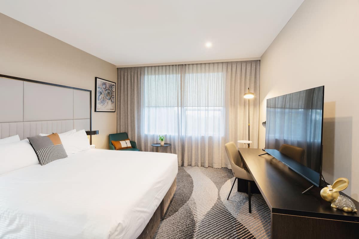 desk, laptop workspace, blackout curtains, iron/ironing board