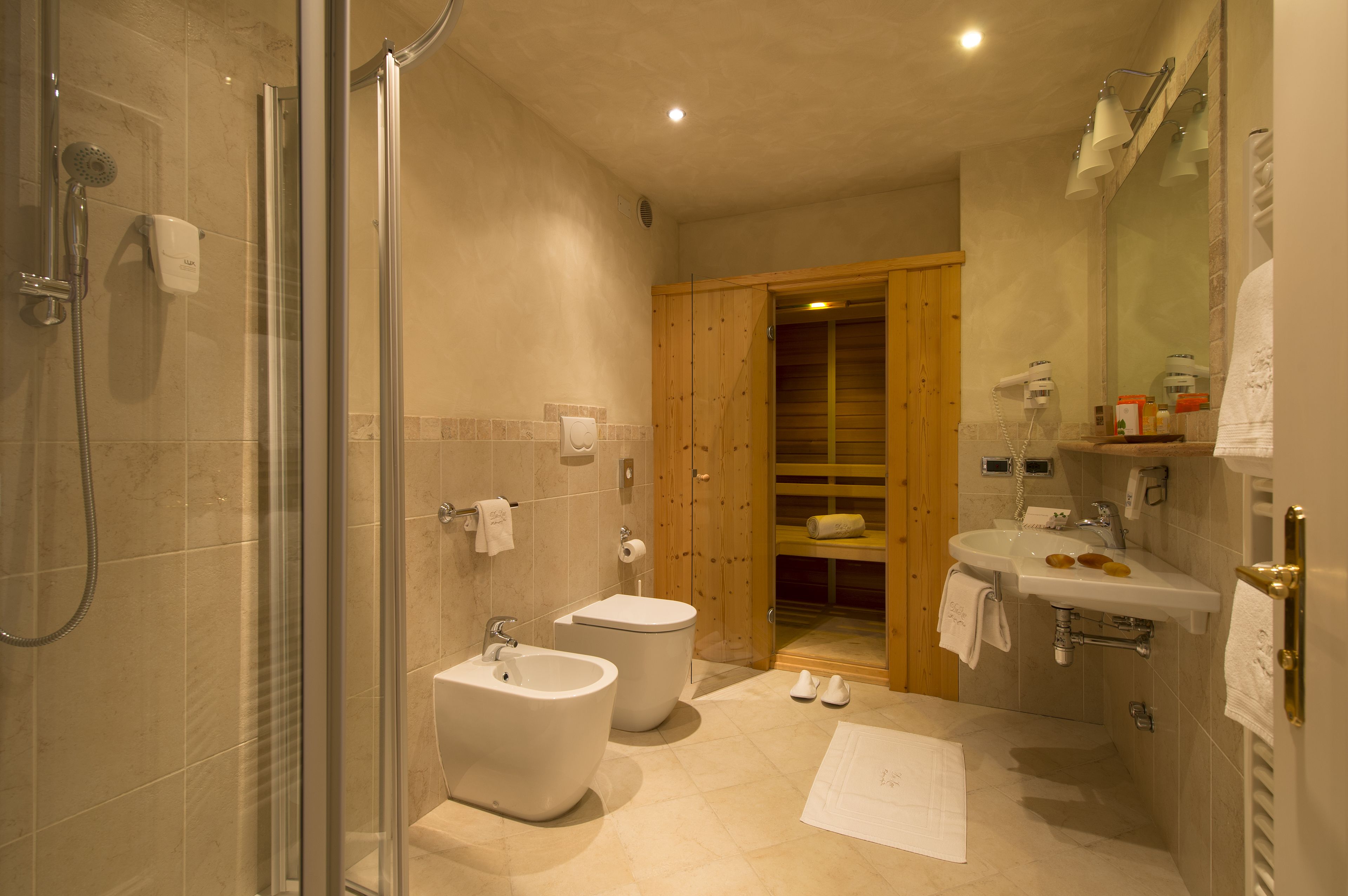 free toiletries, hair dryer, bidet, towels